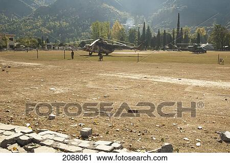 Stock Image - Helicopters On A Landing Pad After The 8 October 2005 Earthquake, Garhi Dopatta, Azad Jammu & Kashmir, Pakistan. Fotosearch