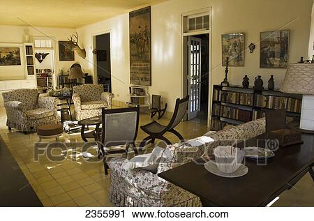 Hemmingway's House, Looking Into Living Room With Furniture, Books And Mounted Mule Deer Head; Alamar, Havana, Artemisa, Cuba View Large Photo Image Stock Image - Hemmingway's House, Looking Into Living Room With Furniture, Books And Mounted Mule Deer Head; Alamar, Havana, Artemisa, Cuba. Fotosearch