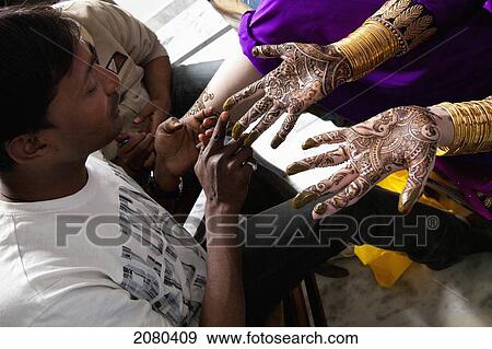 Henna Painted On The Surface Of A Woman's Palms; Ludhiana, Punjab, India View Large Photo Image Stock Photo - Henna Painted On The Surface Of A Woman's Palms; Ludhiana, Punjab, India. Fotosearch