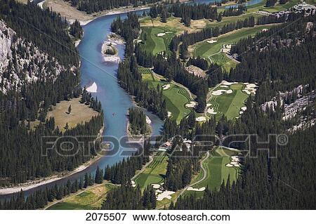 Stock Photo - High Angle Of Banff Springs Golf Course Along The Bow River; Banff Alberta Canada. Fotosearch