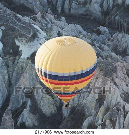 High Angle View Of A Hot Air Balloon In Flight; Goreme Nevsehir Turkey View Large Photo Image Stock Photograph - High Angle View Of A Hot Air Balloon In Flight; Goreme Nevsehir Turkey. Fotosearch