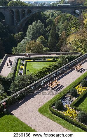 Stock Photograph - High angle view of landscaped gardens and paths in a valley; Luxembourg City, Luxembourg. Fotosearch