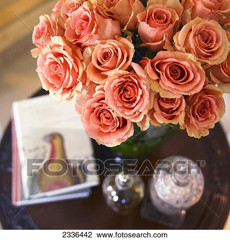 High Angle View Of Orange Roses In Green Vase On Side Table; Victoria, Vancouver Island, British Columbia, Canada View Large Photo Image Stock Image - High Angle View Of Orange Roses In Green Vase On Side Table; Victoria, Vancouver Island, British Columbia, Canada. Fotosearch
