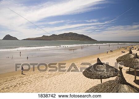 Stock Image - High Angle View Of Sandy Beach With Holidaymakers; Mazatlan, Sinaloa State, Mexico. Fotosearch