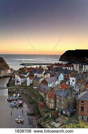 Stock Photo - High Angle View Of Staithes Townscape; North Yorkshire, England, Uk. Fotosearch