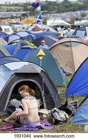 Stock Image - High angle view of tents and people at Glastonbury Festival, officially known as Glastonbury Festival of Contemporary Performing Arts, held on Worthy Farm in June, near village of Pilton, Somerset, England, Europe., Somerset, England, Europe.. Fotosearch