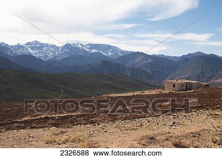 Stock Photo - High Atlas; Morocco, High Atlas mountains landscape with berber house. Fotosearch