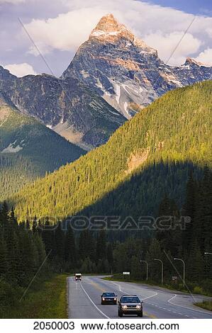 Stock Image - Highway 1 And Mount Sir Donald, Glacier National Park, British Columbia. Fotosearch
