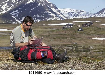 Hiker Checking Map Sitting In Valley, Kungsleden Trail, Abisko, Sweden View Large Photo Image Stock Image - Hiker Checking Map Sitting In Valley, Kungsleden Trail, Abisko, Sweden. Fotosearch