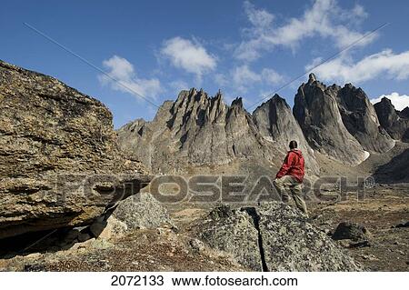 Hiker On Mount Monolith In The Ogilvie Mountains, Tombstone Territorial Park, Northern Yukon View Large Photo Image Stock Image - Hiker On Mount Monolith In The Ogilvie Mountains, Tombstone Territorial Park, Northern Yukon. Fotosearch