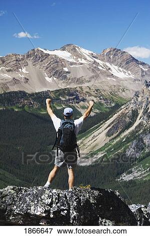 Stock Photo - Hiker On Mountain. Fotosearch