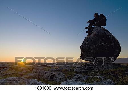 Hiker Sitting On Head-Shaped Boulder View Large Photo Image Stock Photograph - Hiker Sitting On Head-Shaped Boulder. Fotosearch
