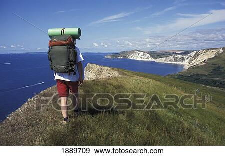 Hiker Walking Towards Worbarrow Bay View Large Photo Image Stock Photo - Hiker Walking Towards Worbarrow Bay. Fotosearch