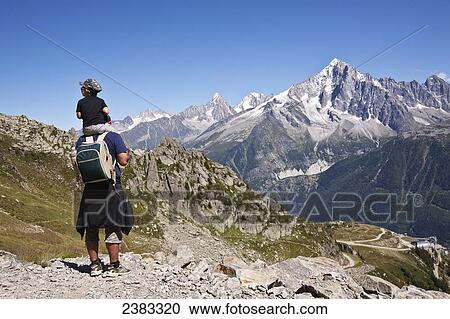 Hikers above Chamonix-Mont Blanc valley, with Mont Blanc massif range mountain in the background; France View Large Photo Image Stock Image - Hikers above Chamonix-Mont Blanc valley, with Mont Blanc massif range mountain in the background; France. Fotosearch