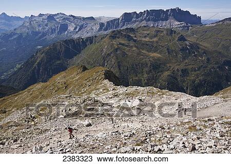 Stock Image - Hikers above Chamonix-Mont Blanc valley; France. Fotosearch