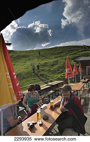 Hikers enjoying a well earned beer at the Hornkopflhutte mountain hut. Kitzb View Large Photo Image Stock Photography - Hikers enjoying a well earned beer at the Hornkopflhutte mountain hut. Kitzb. Fotosearch