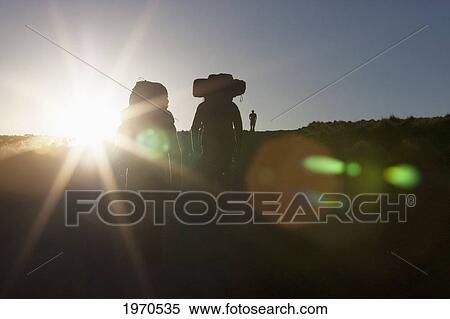 Stock Photography - Hikers In The Miscanti And Miniques Lagoon Area In Antofagasta Region, Chile. Fotosearch
