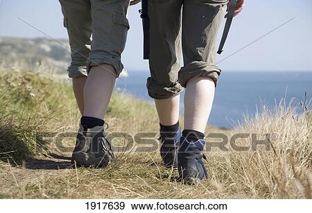 Stock Photo - Hikers On Coastal Path. Fotosearch