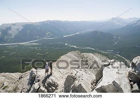 Stock Image - Hikers On Nihahi Ridge, Kananaskis Country, Alberta, Canada. Fotosearch