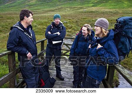 Stock Photo - Hikers Taking Break; Western Lake District, Cumbria, England, Uk. Fotosearch