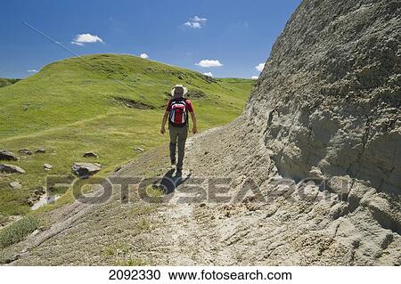 Stock Image - Hiking In The Killdeer Badlands In East Block Of Grasslands National Park; Saskatchewan Canada. Fotosearch