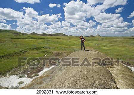 Stock Image - Hiking In The Killdeer Badlands In East Block Of Grasslands National Park; Saskatchewan Canada. Fotosearch