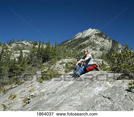 Hiking In The Rocky Mountains, Canmore, Alberta, Canada View Large Photo Image Stock Photo - Hiking In The Rocky Mountains, Canmore, Alberta, Canada. Fotosearch