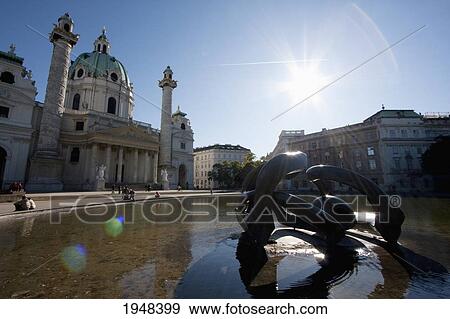 Hill Arches, sculpture by Henry Moore and Karlskirche (Charles' Church), Vienna (Wien), Austria View Large Photo Image Stock Photo - Hill Arches, sculpture by Henry Moore and Karlskirche (Charles' Church), Vienna (Wien), Austria. Fotosearch