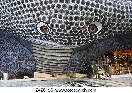 Stock Photograph - Hindu temple with snake image made out of boulders; Rajasthan, India. Fotosearch