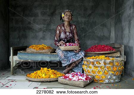 Hindu woman with offerings of flowers; Bali View Large Photo Image Stock Image - Hindu woman with offerings of flowers; Bali. Fotosearch
