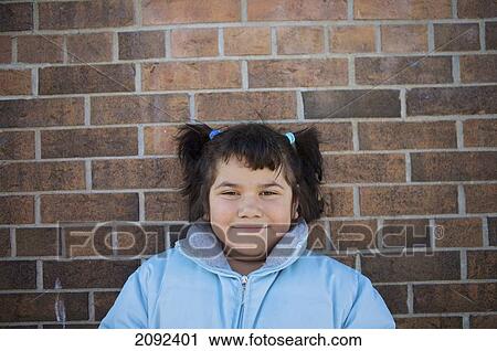 Hispanic Girl Against Brick Wall Of An Esl School; Guelph Ontario Canada View Large Photo Image Stock Image - Hispanic Girl Against Brick Wall Of An Esl School; Guelph Ontario Canada. Fotosearch