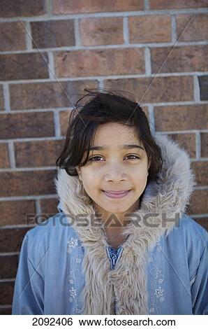 Hispanic Girl Against Brick Wall Of An Esl School; Guelph Ontario Canada View Large Photo Image Stock Photograph - Hispanic Girl Against Brick Wall Of An Esl School; Guelph Ontario Canada. Fotosearch