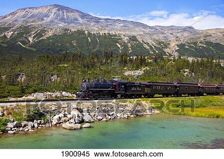 Stock Photography - Historic Train Travels Through White Pass Trail; Skagway, Alaska, United States Of America. Fotosearch