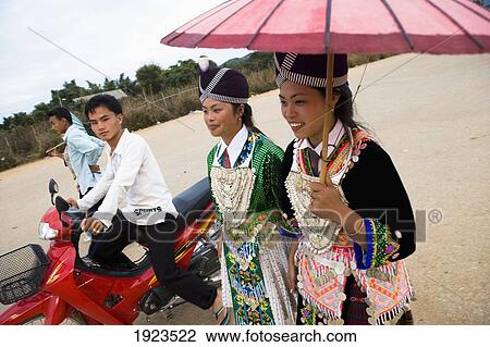 Hmong Girls In Traditional Costume Being Courted By Boys At The New Year Festival, Phonsavan, Laos View Large Photo Image Stock Image - Hmong Girls In Traditional Costume Being Courted By Boys At The New Year Festival, Phonsavan, Laos. Fotosearch