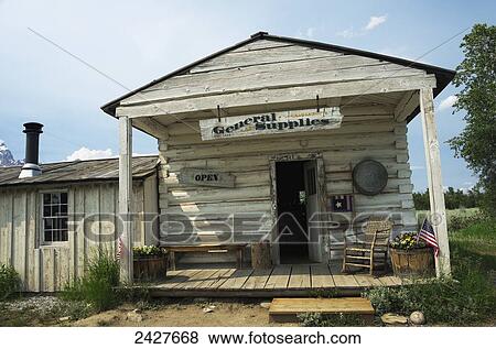 Stock Photo - Holiday Menor's Homestead general store front porch, sign and entrance; Wyoming, United States of America. Fotosearch