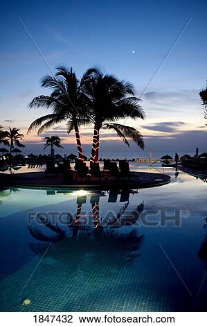 Stock Image - Holiday Resort At Dusk; Puerto Vallarta, Mexico. Fotosearch