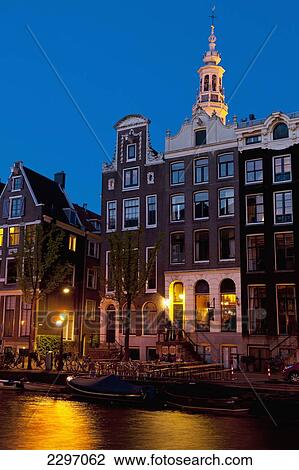 Holland, Bar in gabled house at dusk with spire of Zuiderkerk church in background; Amsterdam View Large Photo Image Stock Image - Holland, Bar in gabled house at dusk with spire of Zuiderkerk church in background; Amsterdam. Fotosearch