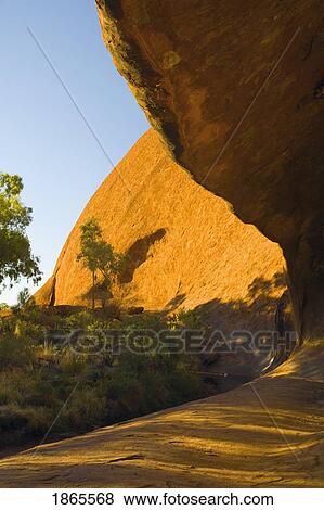 Hollow At The Base Of Ayers Rock, Northern Territories, Australia View Large Photo Image Stock Photo - Hollow At The Base Of Ayers Rock, Northern Territories, Australia. Fotosearch