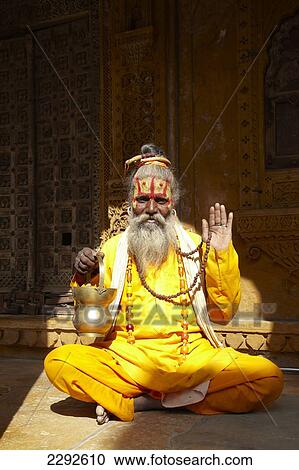 Stock Image - Holy man sitting in a haveli Jaisalmer Rajasthan India. Fotosearch