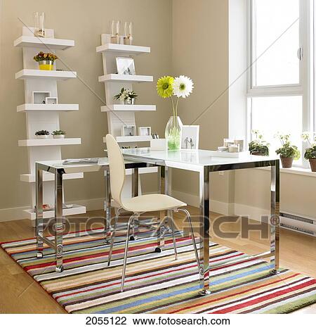 Stock Image - Home Office With Gerbera Daisies On Desk, Victoria, British Columbia. Fotosearch