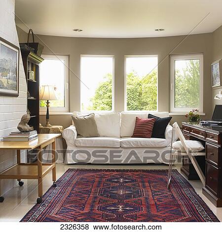 Stock Photo - Home office with window view of treetops; Victoria vancouver island british columbia. Fotosearch