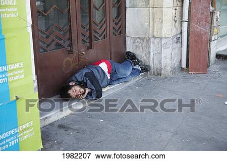 Homeless Person Sleeping On The Street; Istanbul Turkey View Large Photo Image Stock Photo - Homeless Person Sleeping On The Street; Istanbul Turkey. Fotosearch
