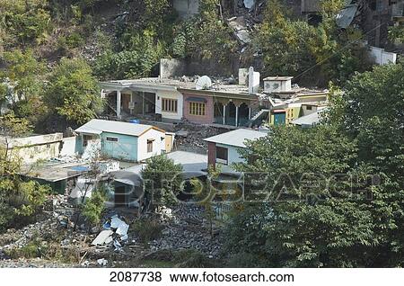 Stock Photo - Homes Damaged By The 8 October 2005 Earthquake, Hatian, Azad Kashmir, Pakistan. Fotosearch