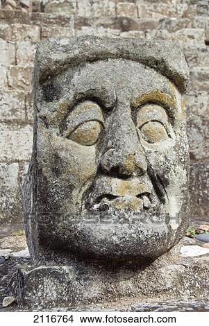 Honduras, Copan Ruinas, Copan Archeological Park, carved stone face on the steps of the East Court View Large Photo Image Picture - Honduras, Copan Ruinas, Copan Archeological Park, carved stone face on the steps of the East Court. Fotosearch