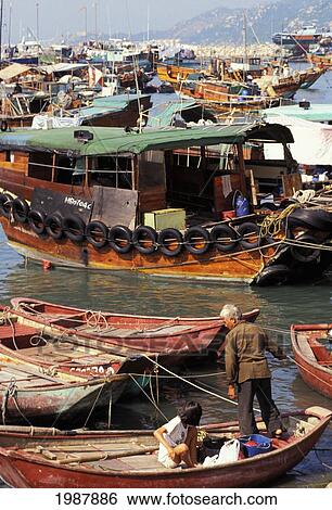 Stock Photograph - Hong Kong, Many Different Shapes And Sizes Of Old Fishing Boats Tied Together No Model Release. Fotosearch