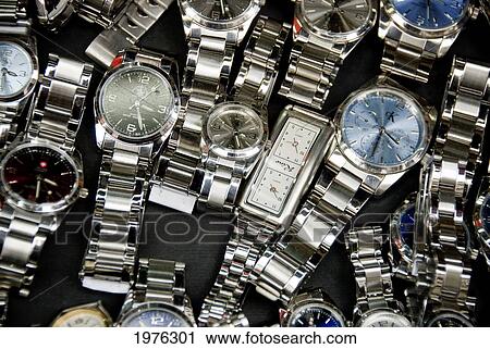 Hong Kong, Yau Ma Tei K, A Table Of Cheap Watches Found At The Temple Street Night Market. View Large Photo Image Stock Image - Hong Kong, Yau Ma Tei K, A Table Of Cheap Watches Found At The Temple Street Night Market.. Fotosearch