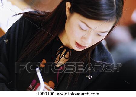 Stock Image - Hong Kong, Young Chinese Woman With Drink.. Fotosearch