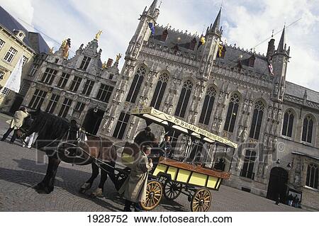 Stock Image - Horse And Carraige At The Town Hall. Fotosearch