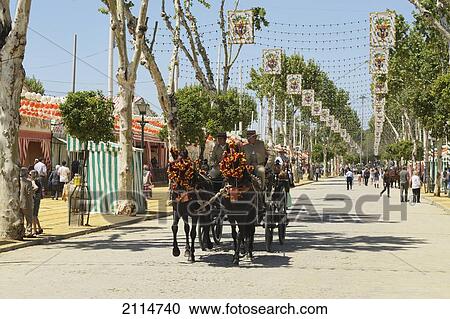Stock Image - Horse And Carriage In The Street For The April Fair; Seville Andalusia Spain. Fotosearch