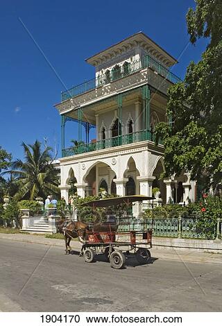 Stock Image - Horse Cart In Front Of Palacio De Valle On Punta Gorda, Cienfuegos, Cuba. Fotosearch
